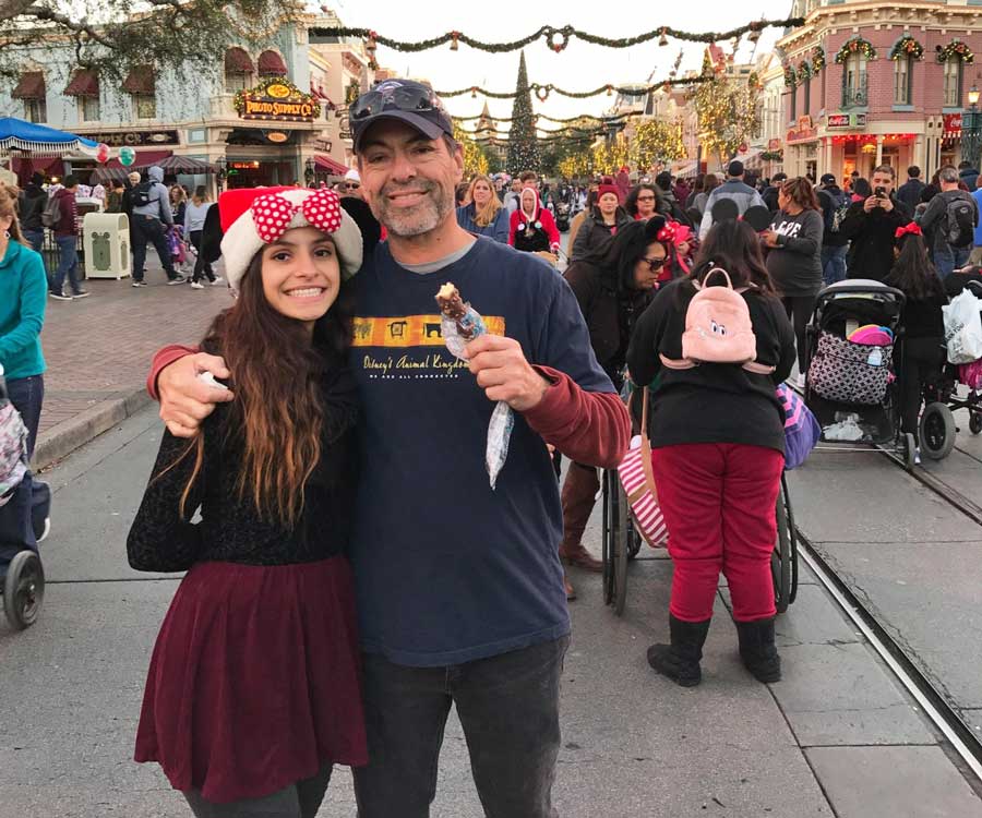 The author with her father and crowds at the Main Street during holiday season