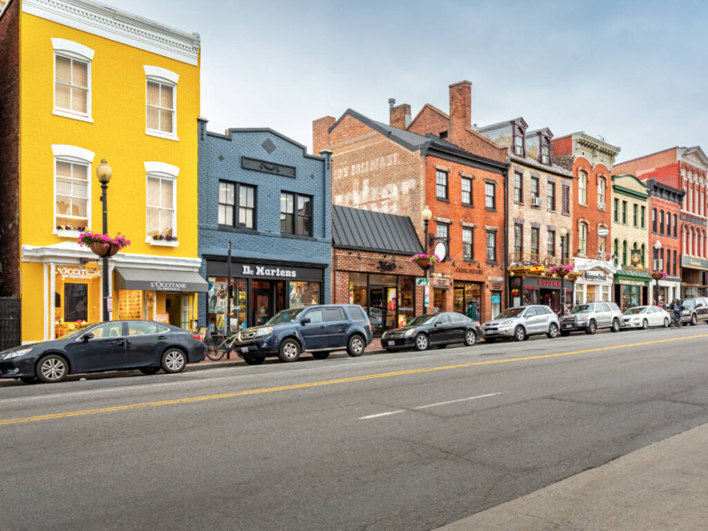 View of cars parked along the side of the main street in Georgetown