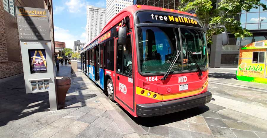 View of a red bus at a bus stop in Denver