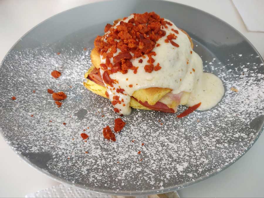 View of a Mallorcas on a plate with dust of sugar powder