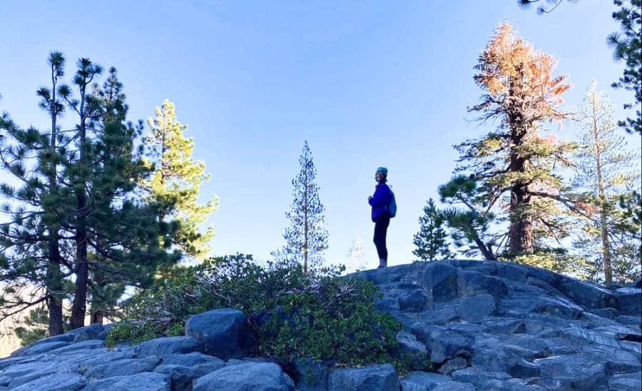 A woman at the top of the mountain during a hike from Devil’s Postpile to Rainbow falls.