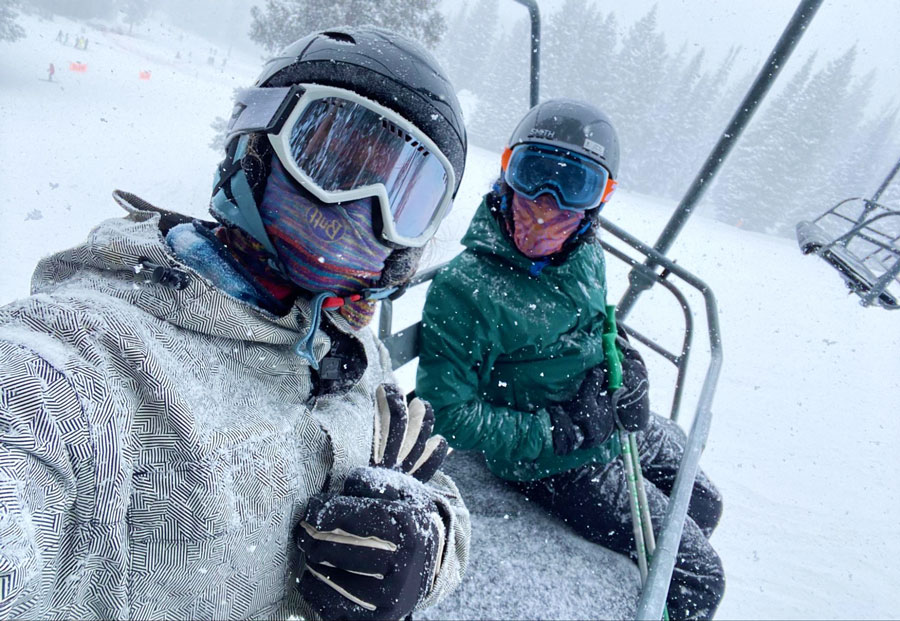 View of two people on a ski lift in Mammoth Mountain during winter