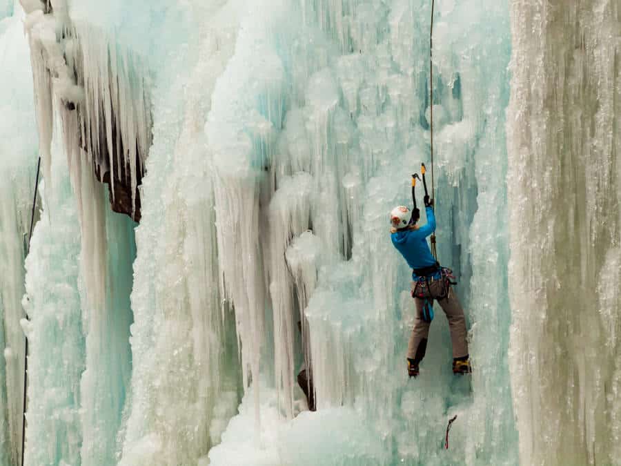 A man climbing on the ice wall in Ouray, Colorado
