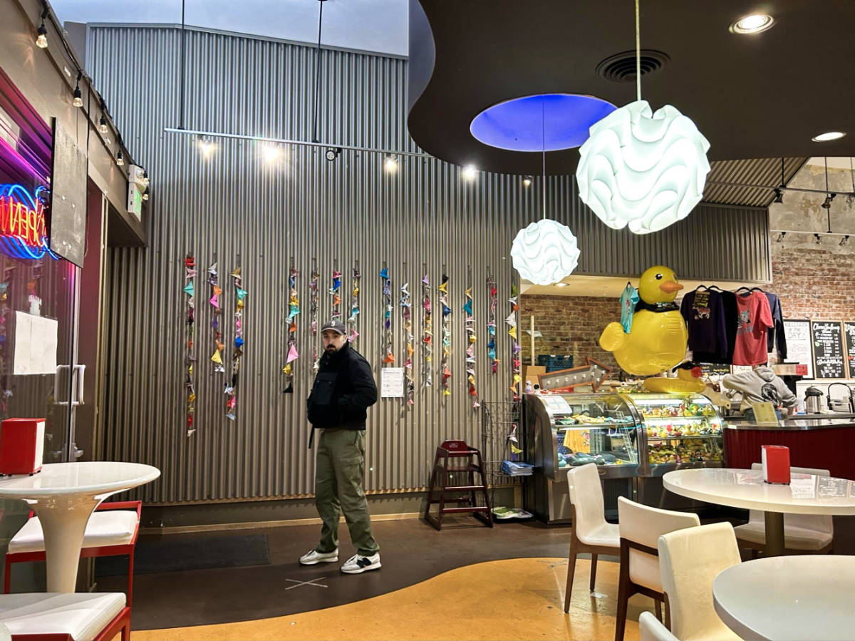 The author's husband wandering inside the duck themed interior of the Bellingham’s Mallard Ice Cream