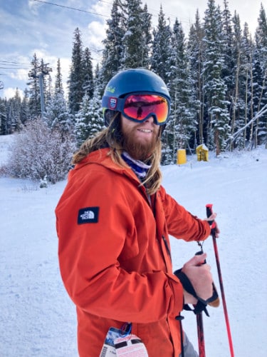 The author Abigail Bliss' husband on a full winter and ski gear in a ski resort
