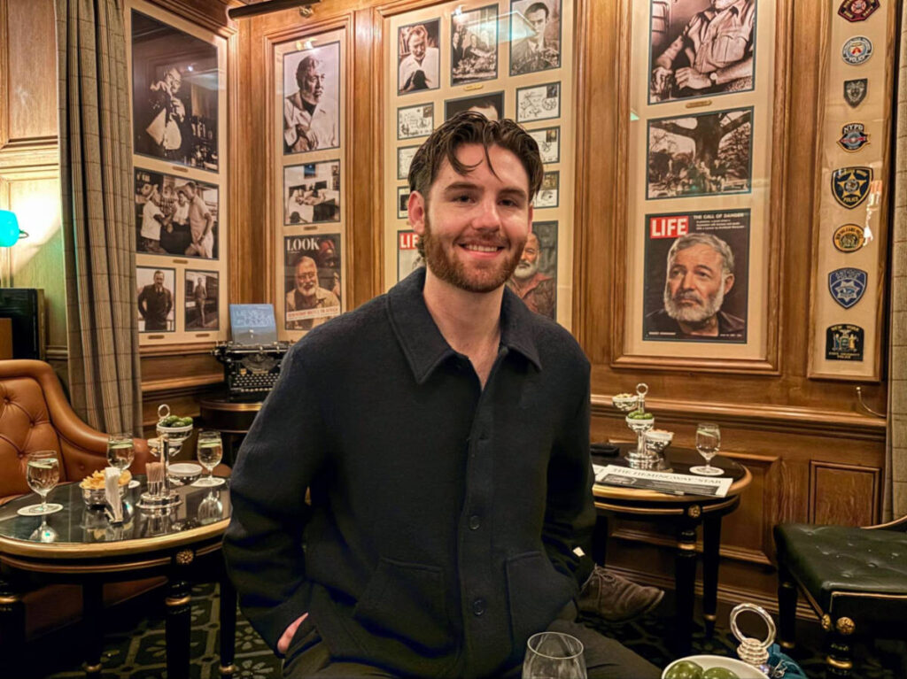 A man enjoying a drink at Bar Hemingway