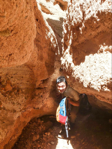 A man passing through the small path at Pingshan Lake Grand Canyon