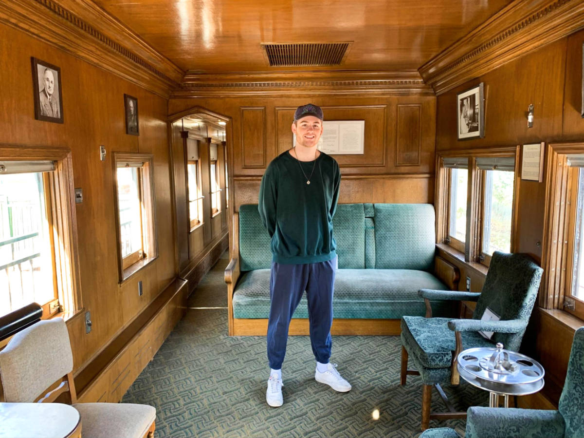 A man standing inside the McCormick-Stillman Railroad Park