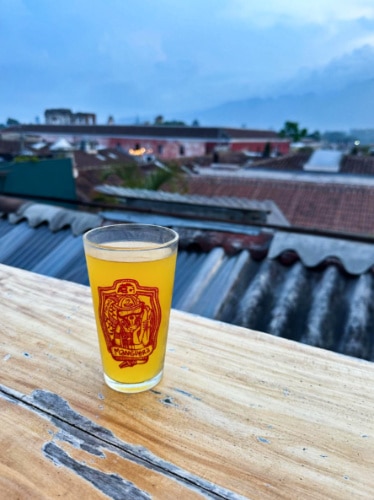A glass of Mango Cider at the rooftop terrace
