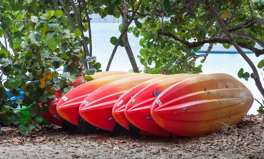 Red Yellow kayaks on a sand