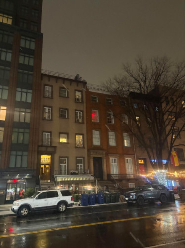 A rainy night street scene in Manhattan’s East Village