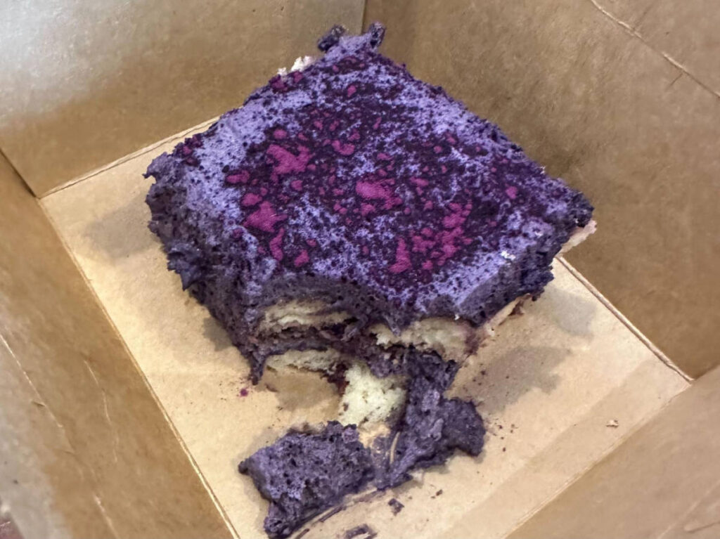 An ube tiramisu on a box from Mano Modern Cafe