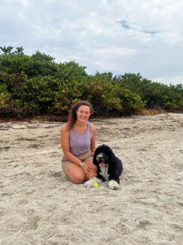 Marina Martinelli with her dog on a beach in Tampa, Florida