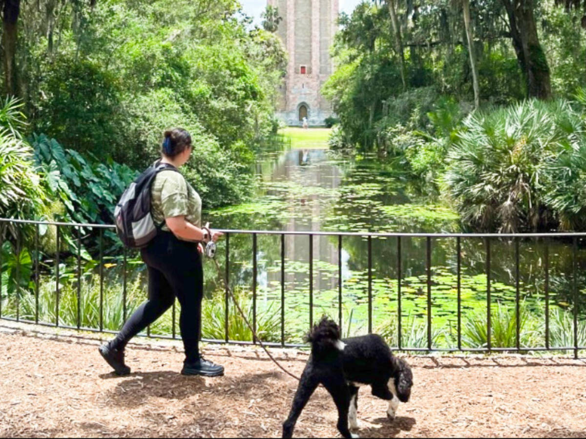 The author (Marina) and her dog Athena exploring the Bok Tower Gardens in Lake Wales