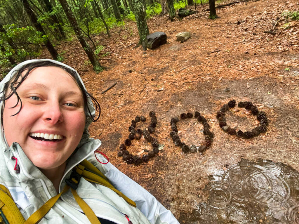 The author Marina, posing for a photo at the 800-mile marker of the Appalachian Trail