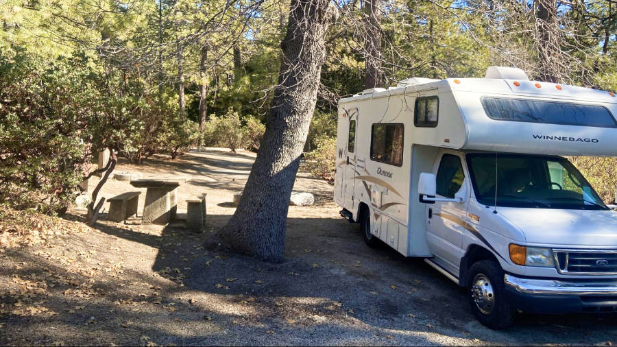 A motorhome parked at the camping ground in Idyllwild