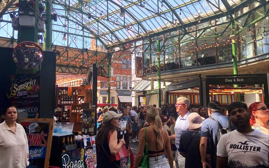 View of people wandering in a market in London