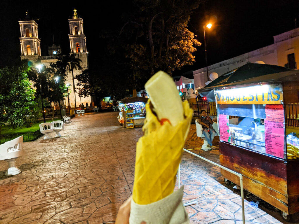 A hand holding a Marquesita in Valladolid, Mexico