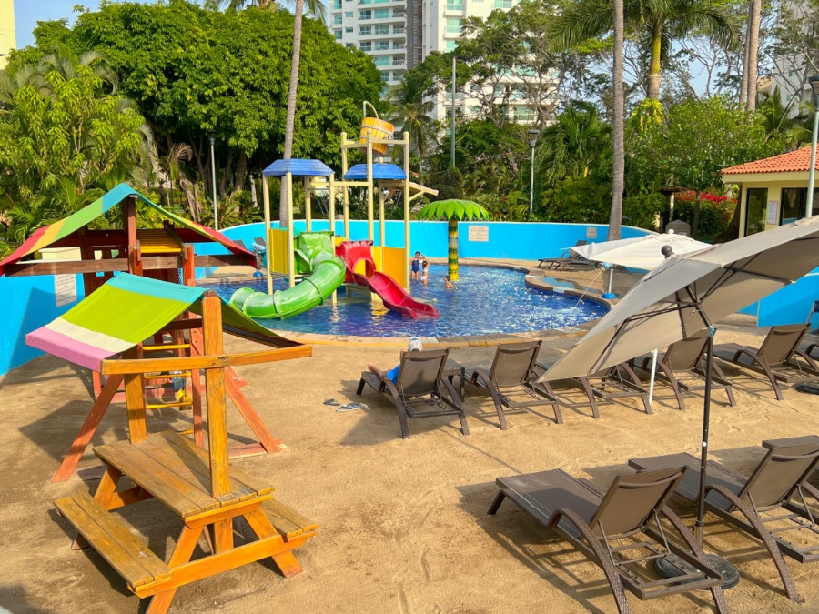 View of a pool in Marriot Resort Puerto Vallarta with slides on it