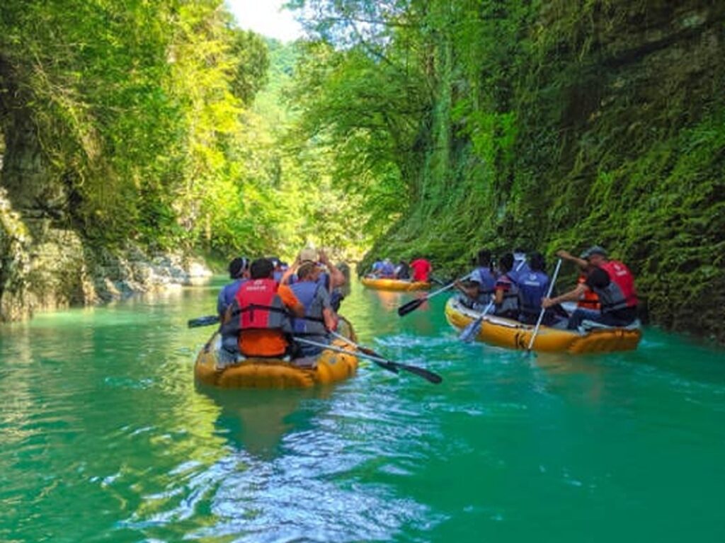 Tourists rafting on the turquoise waters of Martvili Canyon