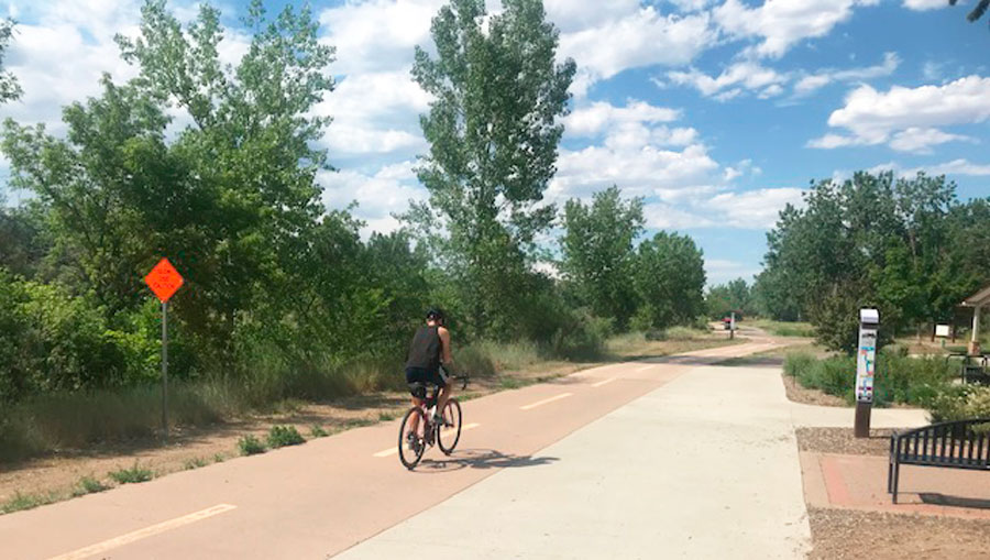A man biking in Mary Carter Greenway Trail