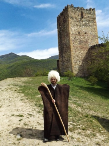 The author Matthew Reppond, on a traditional shepherd’s attire at the Ananuri Fortress Complex
