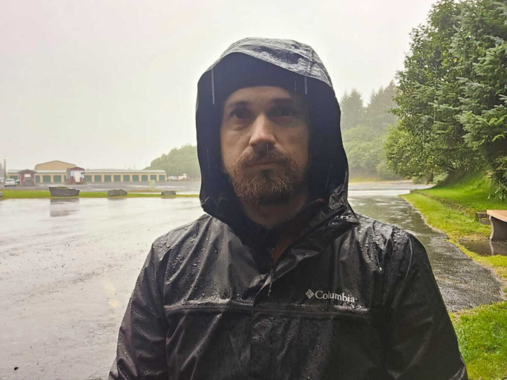 The author Matthew Reppond wearing a waterproof jacket under the rain