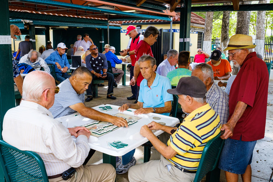 View of elderly playing dominos in The Domino Park in Miami