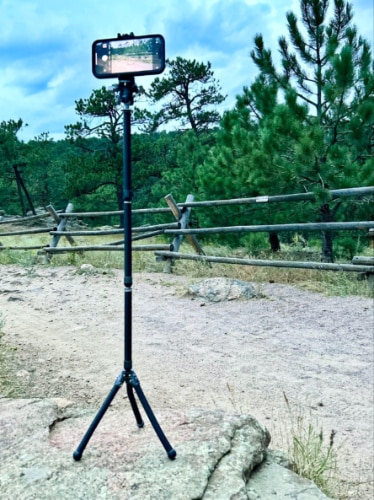 A cellphone mounted on Benro Tablepod Flex Tripod on a maximum height