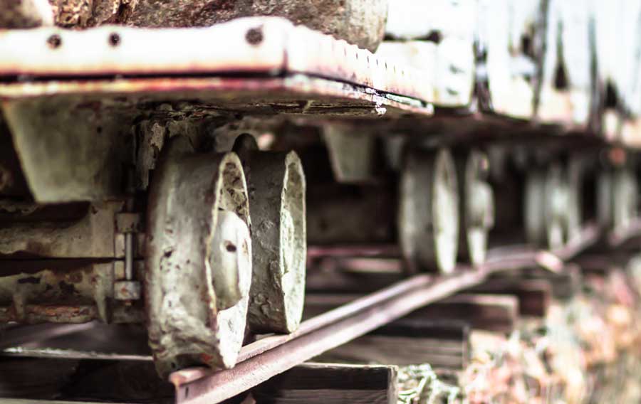 View of an old metal gold mining cart on track in Silverton