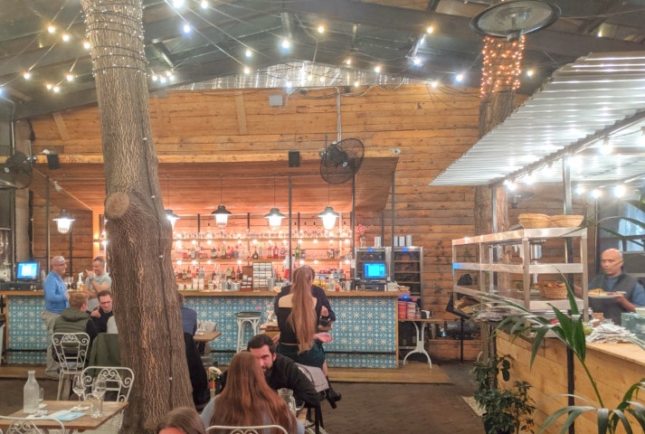 View of people dining at the Mazel Tov restaurant