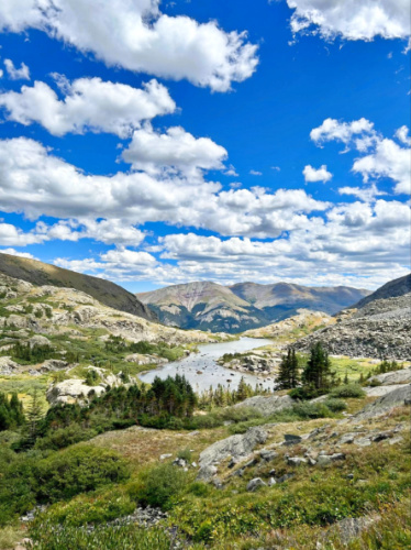 Overlooking view of the mountain ranges and the first alpine lake within McCullough Gulch