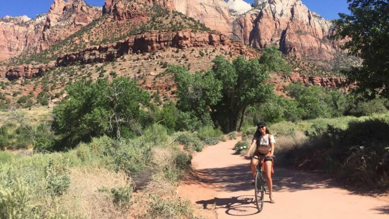 The author McKenna Mobley riding a bike