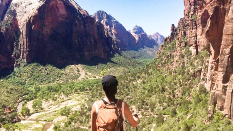 The author McKenna Mobley watching the mountain views from the trail