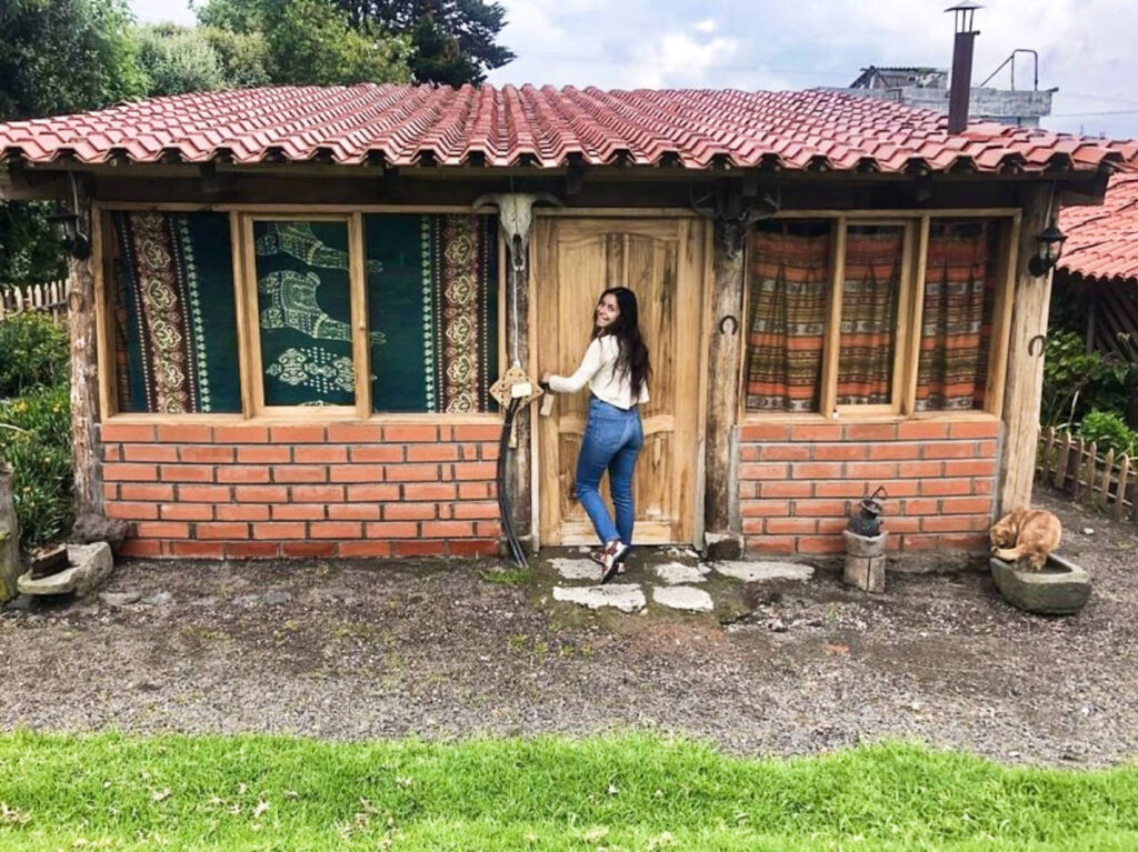 The author McKenna Mobley, posing at her door front's lodge in Tanicuchí