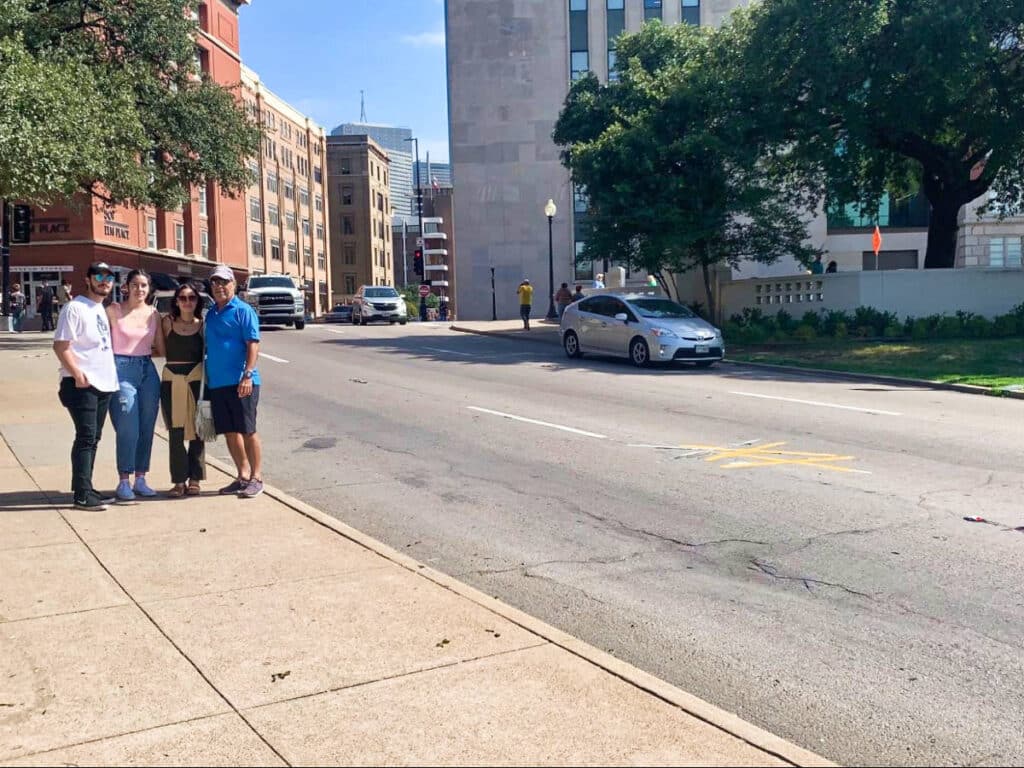 The author McKenna Mobley with her family, posing for a photo on Elm St.