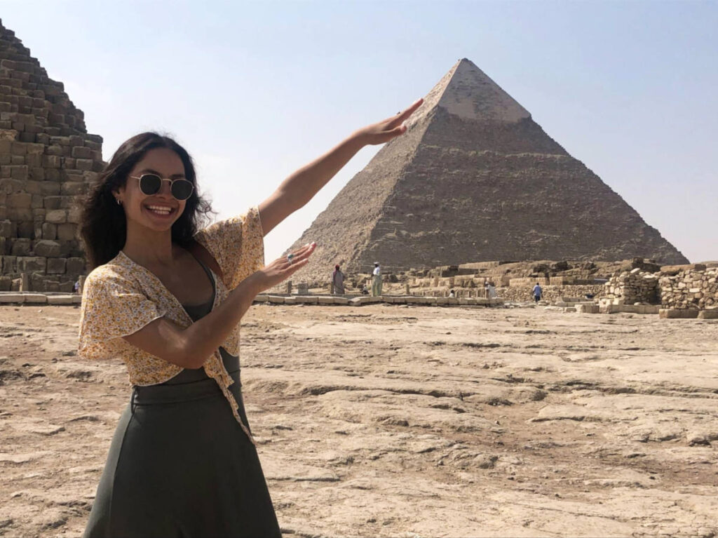 The author Mckenna Mobley, posing in front of the Great Pyramid of Giza