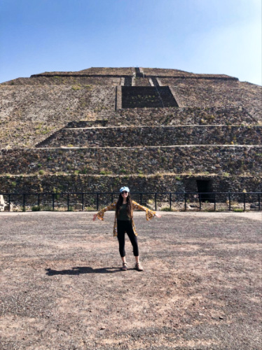 The author McKenna Mobley, posing in front of the Pyramid of the Moon in Teotihuacan