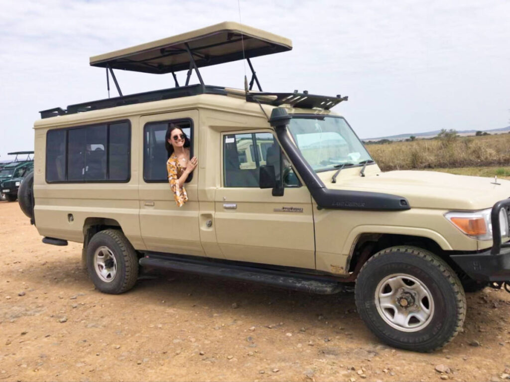 The author Mckenna Mobley on the safari car in Serengeti National Park