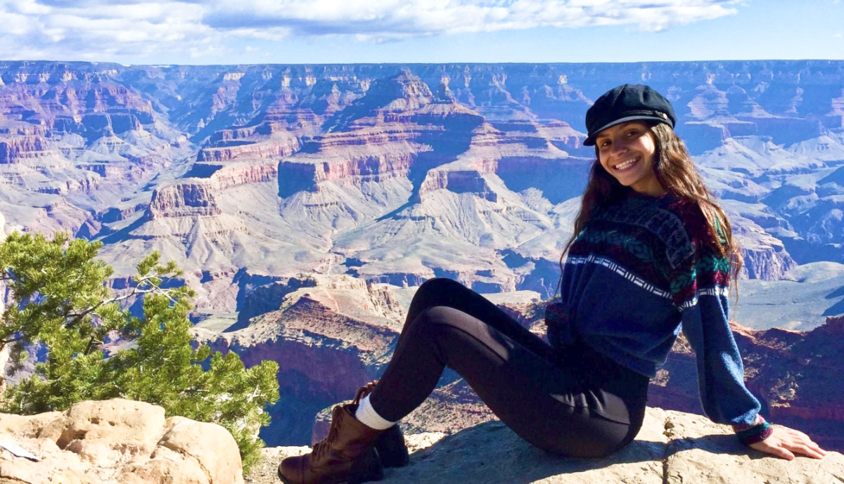 Travel Lemming Writer, McKenna posing with the scenic Grand Canyon view in the background