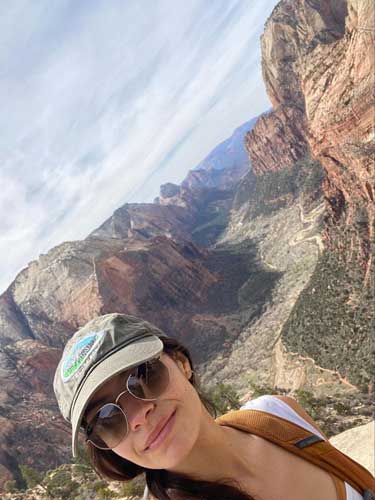 The author smiling for a selfie at the Angels Landing