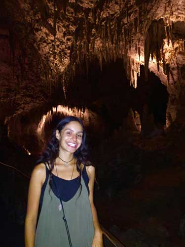 Travel Lemming writer McKenna smiling for a photo inside the Carlsbad Caverns National Park