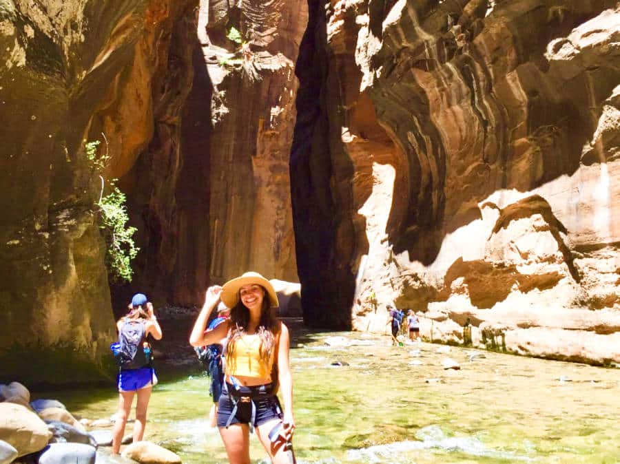 The author McKenna Mobley posing in the Zion National Park Narrows