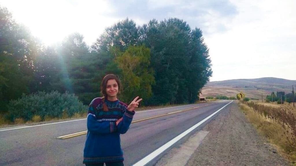 The author McKenna Mobley, posing on the side of the road of Patagonia
