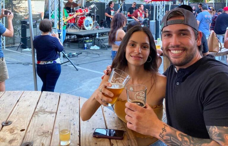 The author McKenna Mobley with her cousin holding a glass of beer from Old Stump Brewing Company