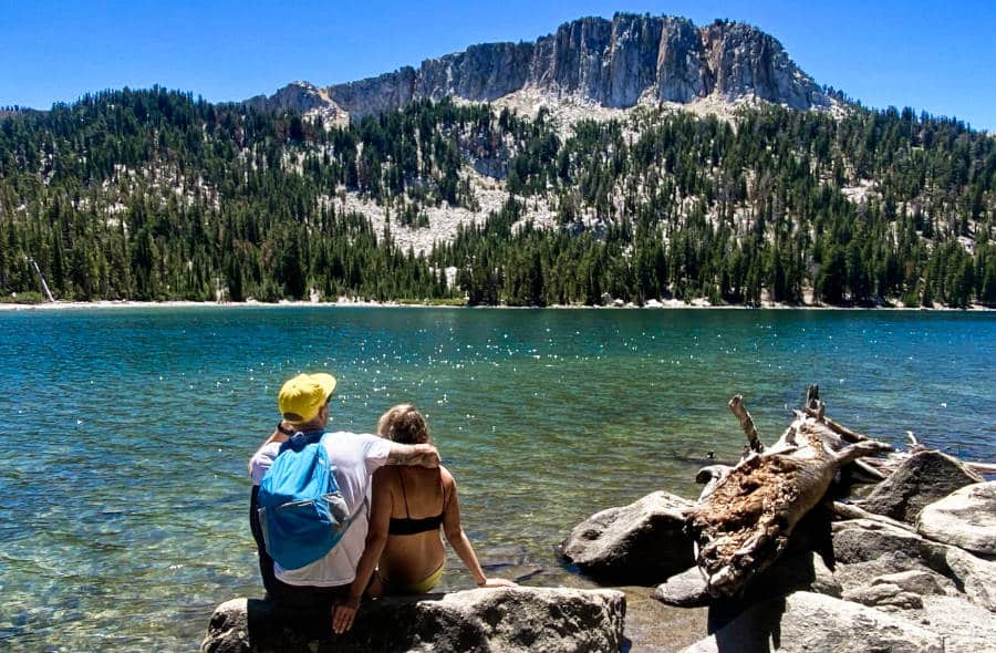 A couple sitting peacefully while looking at the breathtaking view of Lake McLeod.