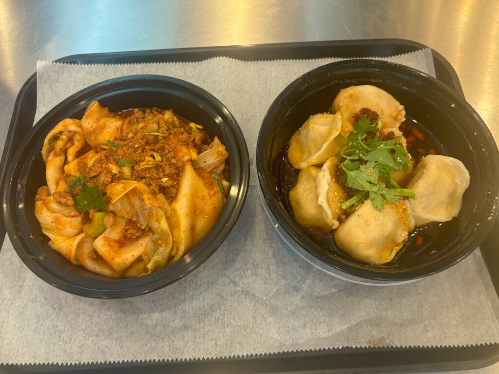 Pork dumplings and handmade noodles in a bowl from Xian Famous Foods