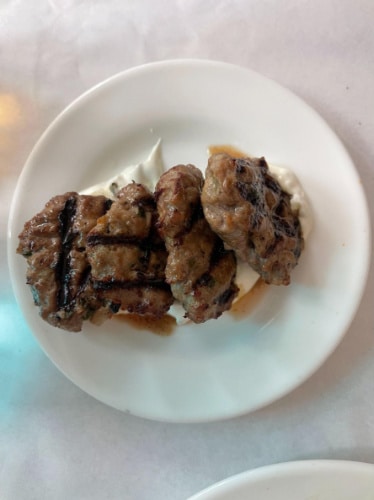 Lamb meatballs on a plate served in KAVA Neo-Taverna