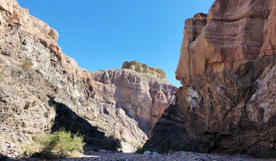 The rocky path in Mecca Hills Wilderness and the clear blue sky above it