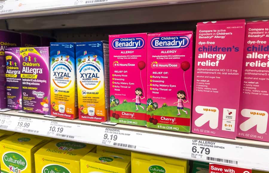 Different kinds of medications on a shelf in a store